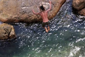 Man jumping into water hole in Galle  