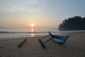Sunset and boat on Talalla Beach   